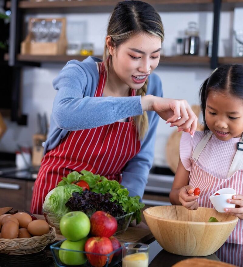 young-mother-teach-daughter-in-the-kitchen-learn-online-cooking-clean-food-from-the-laptop-computer.jpg
